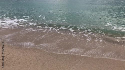 Green waves of the Mediterranean Sea, sand beach
