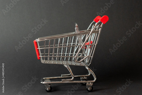 shopping trolley on a black background 