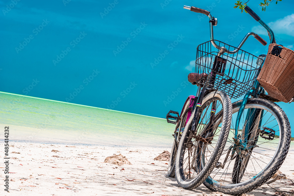 Fototapeta premium Turquoise bike parked at the beach, in the Mexican Caribbean