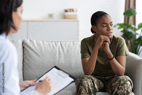 Portrait of black soldier woman having therapy meeting with psychologist