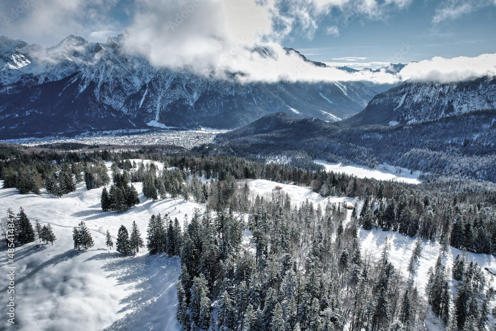 Karwendel - winter landscape with snow covered mountains and forest 
