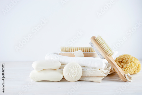 Various soap bars, natural fibre textile and natural brushes. Zero waste, slow living concept