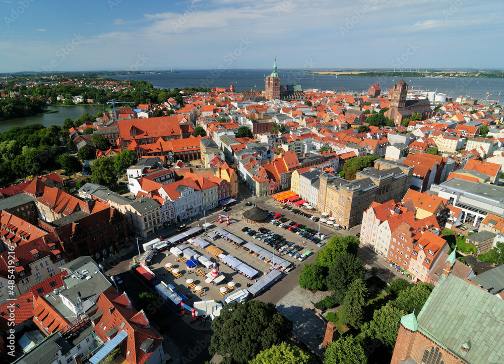 Aerial View To The Market Place At Neuer Markt In Stralsund Historic District And The Island Ruegen In The Background At The Baltic Sea Germany On A Beautiful Sunny Summer Day With A Clear Blue Sky
