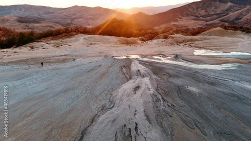 Aerial footage from drone with muddy volcano from Romanian mountains , Buzau county , Carpathian mountains , aerial landscape ,Paclele mici and Paclele Mari , vulcanii noroiosi 