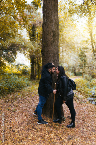 Couple in love touching their noses during an excursion in the forest © EGHStock