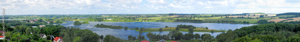 Panorama View from The Parnass Tower To The Lake Of Ploen Germany On A Beautiful Sunny Summer Day With A Blue Sky And A Few Clouds