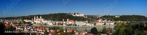Panorma View From The River Inn To The Old City Of Passau And Fort Veste Oberhaus Germany On A Beautiful Sunny Summer Day With A Clear Blue Sky And A Few Clouds