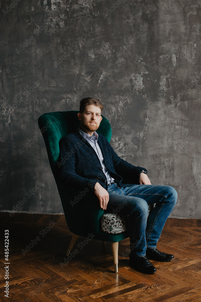 young man with beard is laughing 