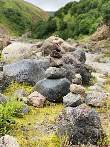 Pyramid of stones on the backdrop of mountains in the Elbrus region. Balance  meditation and stability concept