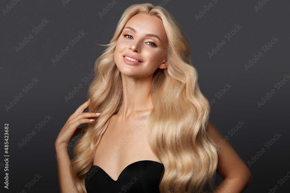 Beautiful blond girl with a perfectly curls hair, and classic make-up. Beauty face and hair. Beautiful blond girl with a perfectly curls hair, and classic make-up. Beauty face and hair.