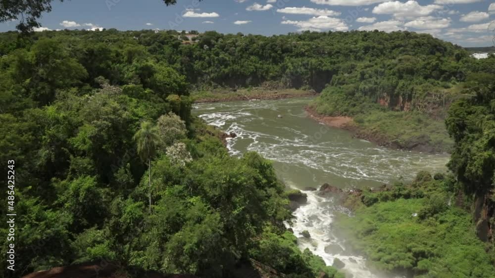 Eco tourism. View of the jungle, lush vegetation, and river flowing across the rainforest in Brazil. Eco tourism. View of the jungle, lush vegetation, and river flowing across the rainforest in Brazil.