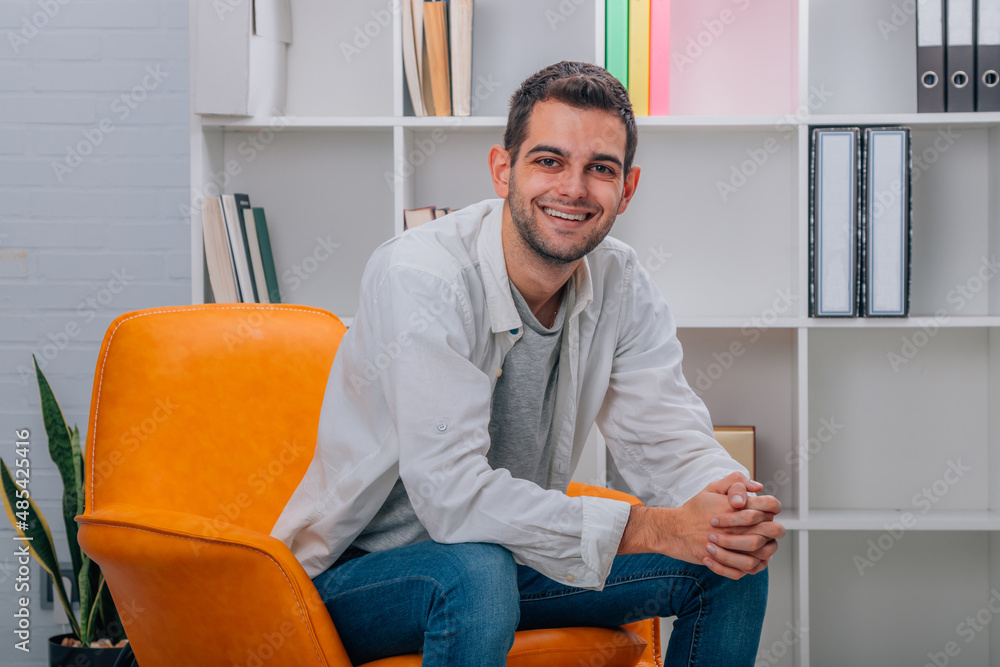 young man at home sitting on the sofa young man at home sitting on the sofa