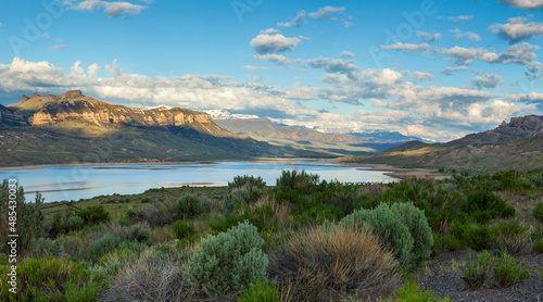 Panorama of the Absaroka Mountains of Wyoming above the Buffalo Bill Reservoir on a bright summer morning photo