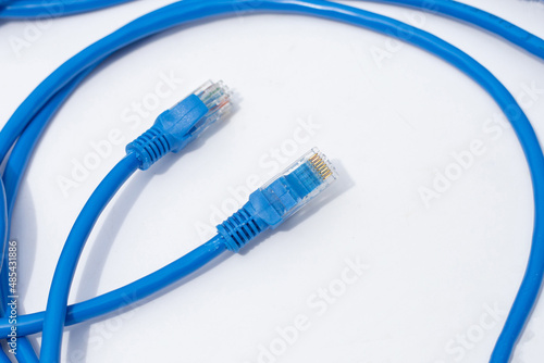 LAN network connection ethernet blue cables on white background.