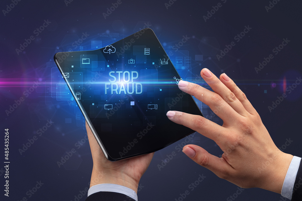 Businessman holding a foldable smartphone, security concept Businessman holding a foldable smartphone, security concept
