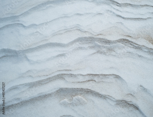 Striations of snow and sand background texture © Marcus