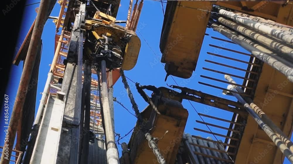 Top Drive System TDS and Derrick of Oil Drilling Rig. Oil and Gas Drilling Rig Top Drive System TDS and Derrick of Oil Drilling Rig. Oil and Gas Drilling Rig
