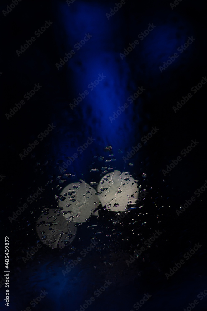 Abstract dark blue background with bright blue patches of color and some light bokeh Abstract dark blue background with bright blue patches of color and some light bokeh