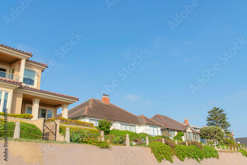 Residential houses exterior near the edge with chain railings at Oceanside, California