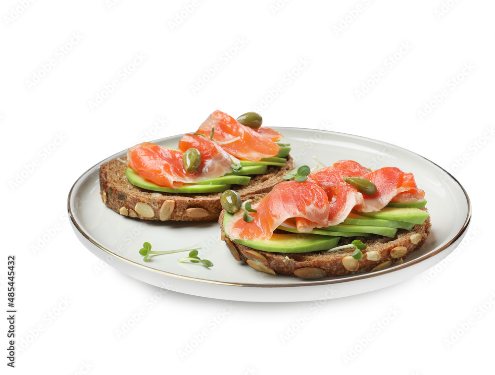 Delicious sandwiches with salmon, avocado and capers on white background