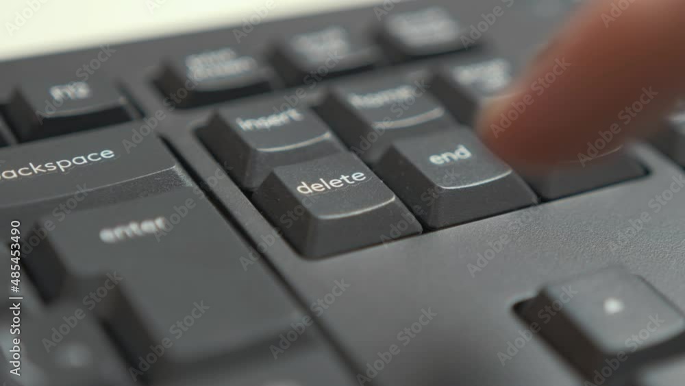 Pressing 'Delete' keybinding on keyboard Close up Pressing 'Delete' keybinding on keyboard Close up
