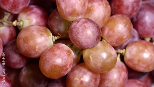 Fresh red grapes rotation background