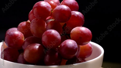 Fresh red grapes rotation background