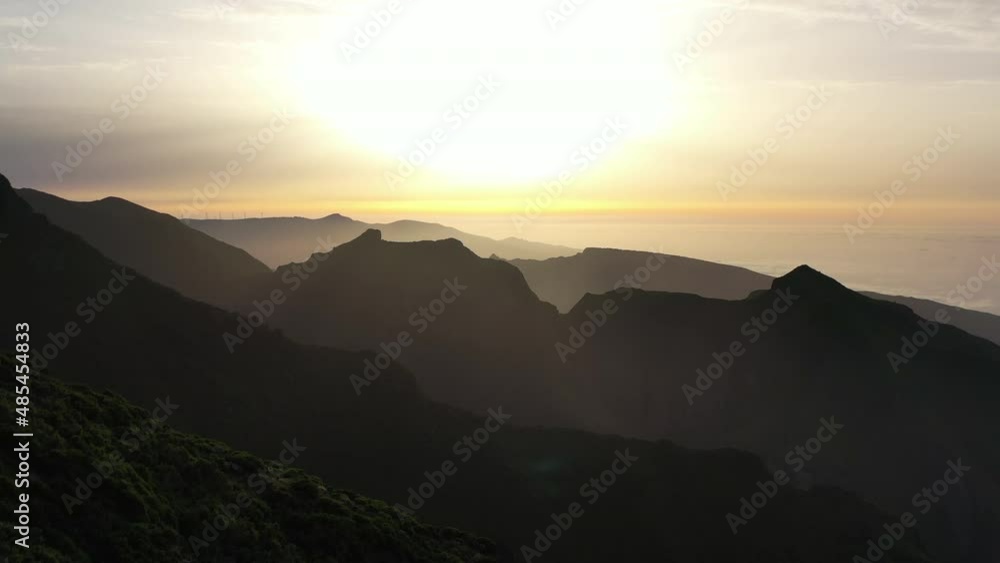 Golden Hour Sunlight Above Atlantic Ocean and Silhouettes of Hills, Aerial View of Madeira Island Landscape, Portugal Golden Hour Sunlight Above Atlantic Ocean and Silhouettes of Hills, Aerial View of Madeira Island Landscape, Portugal