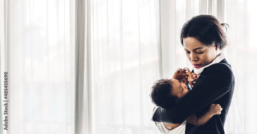 Portrait of enjoy happy love family african american mother playing with adorable little african american baby.Mom kiss with cute son moments good time in a white bedroom.Love of black family Portrait of enjoy happy love family african american mother playing with adorable little african american baby.Mom kiss with cute son moments good time in a white bedroom.Love of black family