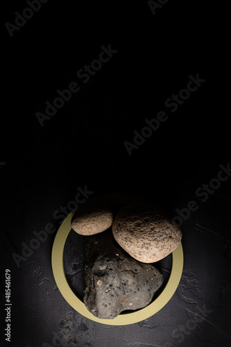 Canvas Print Dark shadow background with green circle, stones and rock