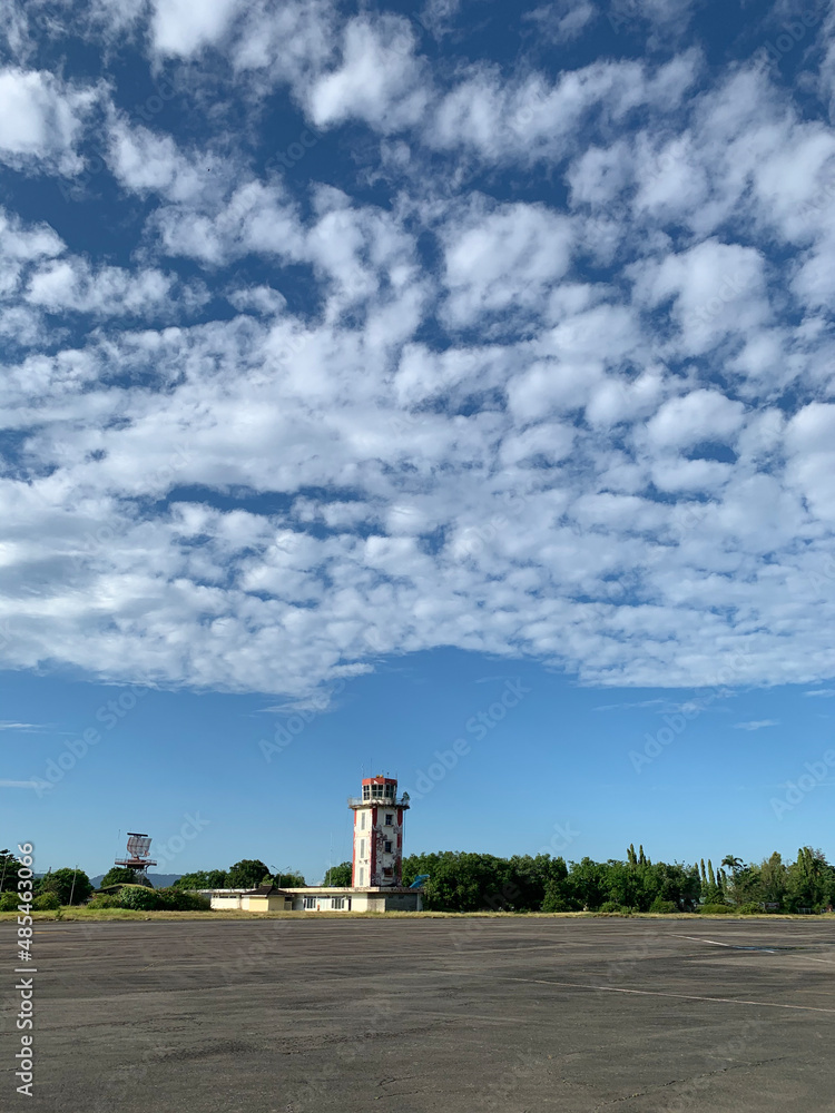 old abandoned tower buildings with cloudy sky blue sky background