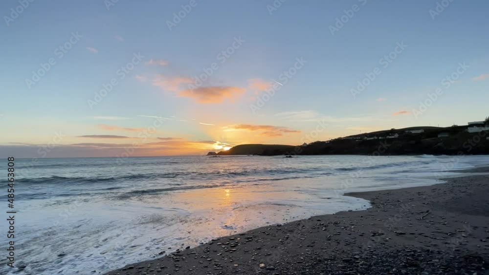 Beautiful sunset wide angle, sandy beach in Ireland during winter Beautiful sunset wide angle, sandy beach in Ireland during winter