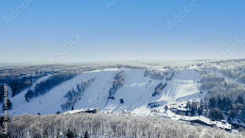 winter ski slope landscape in the mountains aerial