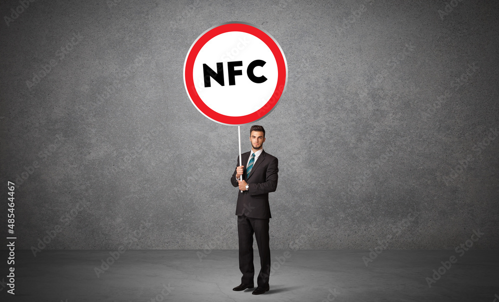 Young business person holdig traffic sign Young business person holdig traffic sign