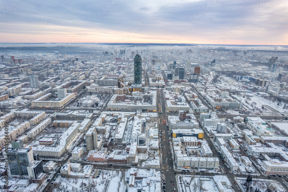 Yekaterinburg aerial panoramic view at Winter in cloudy day. Karl Liebknecht Street and Lenin Avenue.