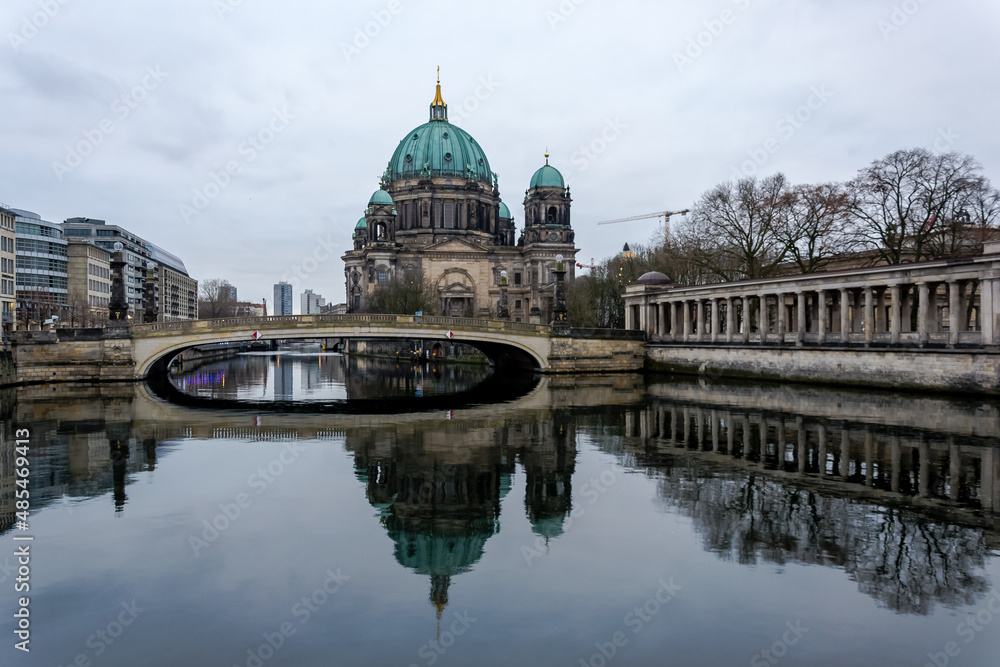 View of the Berliner Dom (Berlin Cathedral), a monumental German Evangelical church and dynastic tomb (House of Hohenzollern) on the Museum Island in central Berlin from the bank of the River Spree