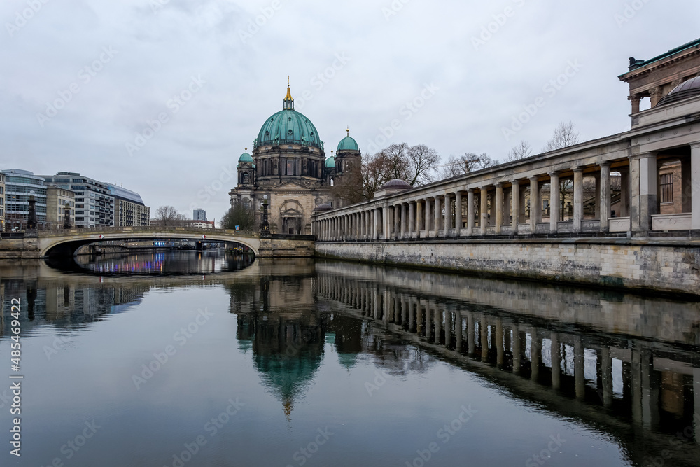 Fototapeta premium View of the Berliner Dom (Berlin Cathedral), a monumental German Evangelical church and dynastic tomb (House of Hohenzollern) on the Museum Island in central Berlin from the bank of the River Spree