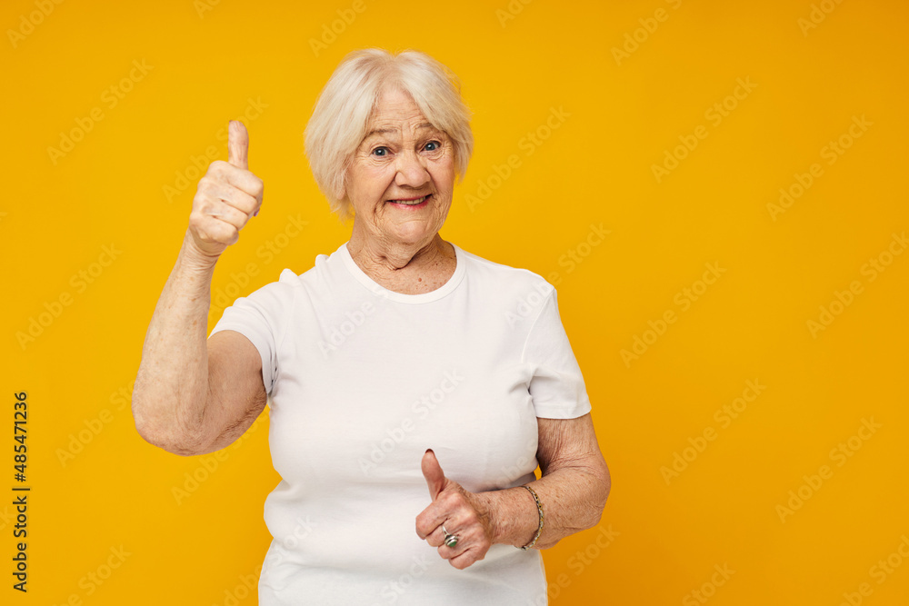 Portrait of an old friendly woman happy lifestyle joy isolated background Portrait of an old friendly woman happy lifestyle joy isolated background