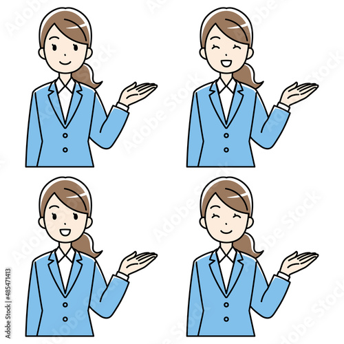 笑顔で案内するスーツの女性（左手上げ・カラー）