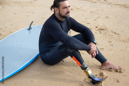 Photography Concentrated man resting after training on deserted beach