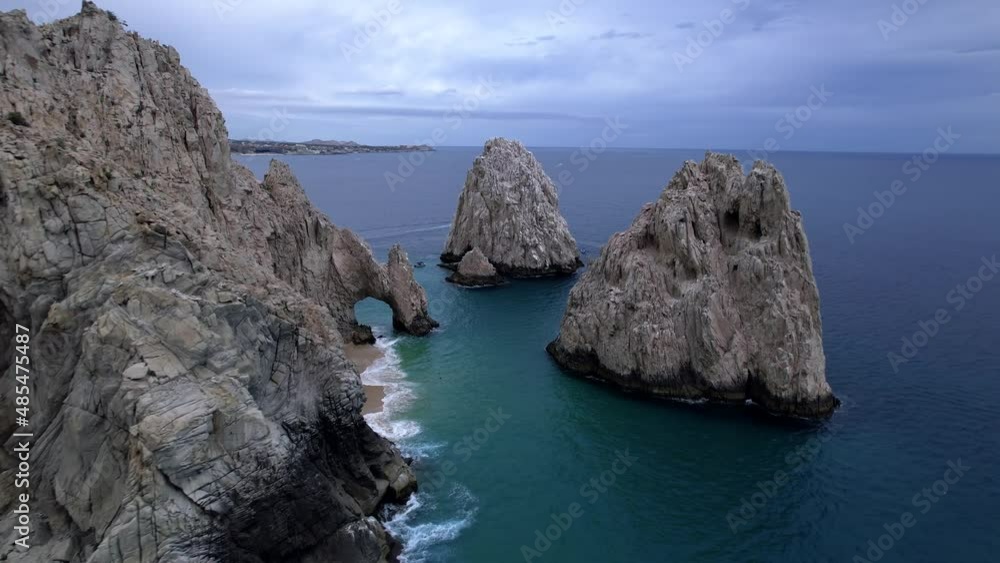 Famous rock formation called El Arco (the Arch) in Cabo San Lucas - dynamic aerial parallax view of the landmark Famous rock formation called El Arco (the Arch) in Cabo San Lucas - dynamic aerial parallax view of the landmark