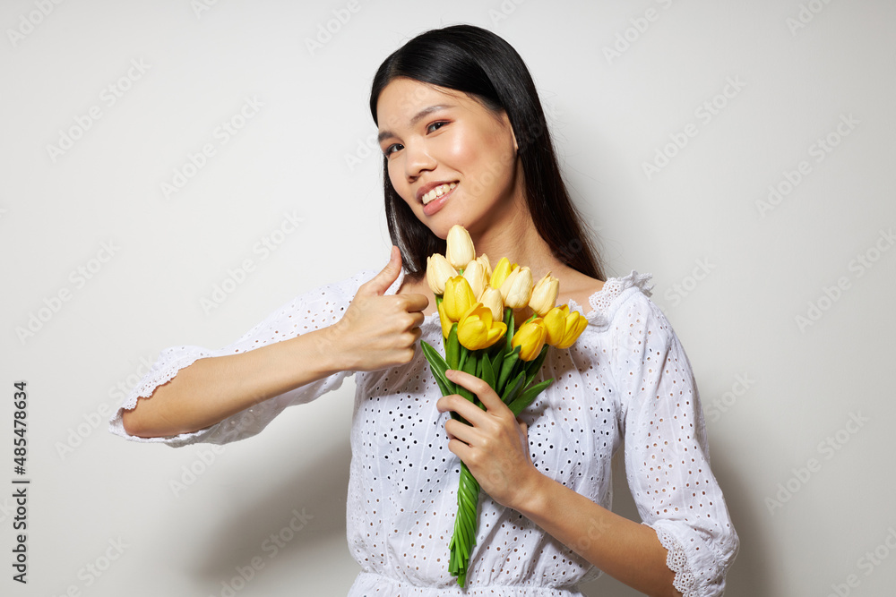 woman in a white shirt flowers spring posing studio model unaltered woman in a white shirt flowers spring posing studio model unaltered