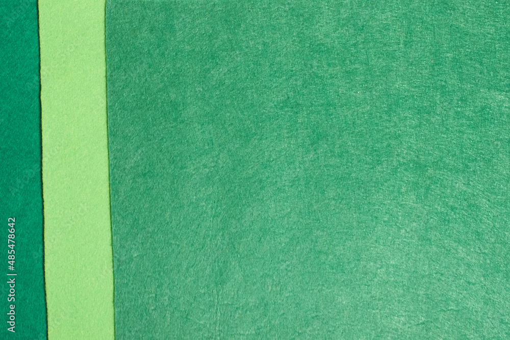 Fototapeta premium The background is made of felt in three shades of green