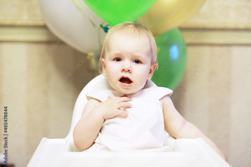 Fototapeta premium Birthday one year old girl with baloons