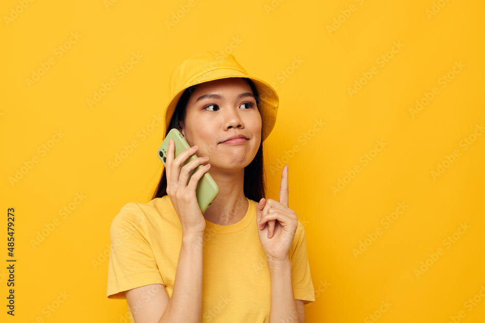 pretty brunette talking on the phone posing fashion isolated background unaltered pretty brunette talking on the phone posing fashion isolated background unaltered