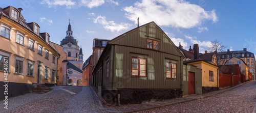 Old 1700s apartment houses with tin roofs and chimneys in the district Södermalm a winter day in Stockholm photo