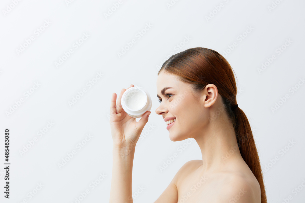 pretty woman jar of cream in hands clean skin posing isolated background pretty woman jar of cream in hands clean skin posing isolated background