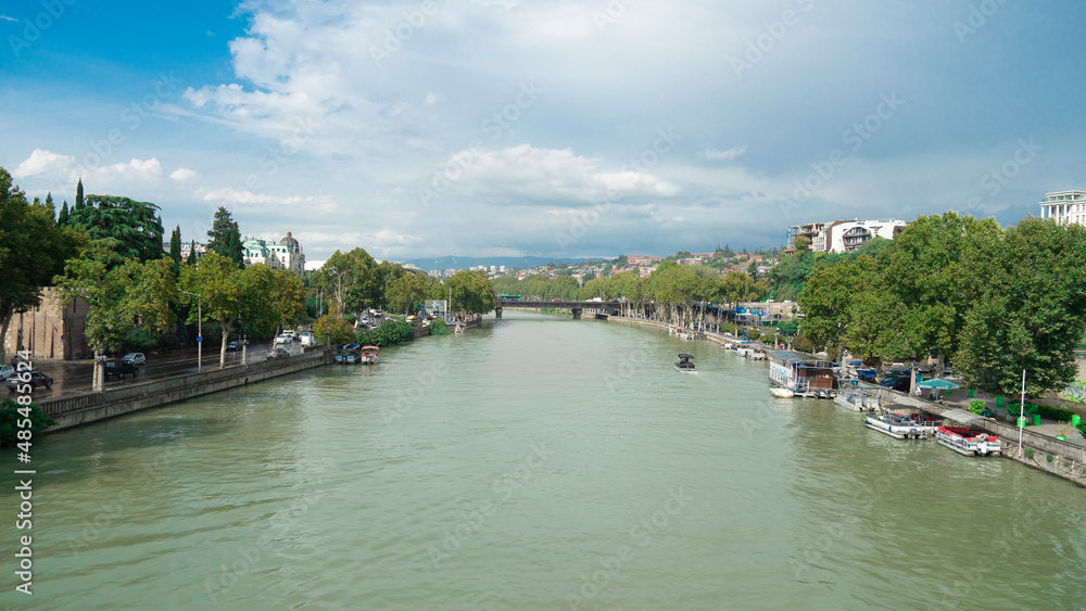 canal in the city. dirty river flows in the city