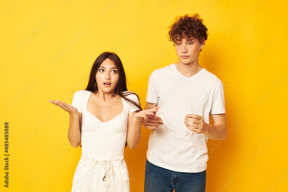 portrait of a man and a woman standing side by side in white t-shirts posing Lifestyle unaltered portrait of a man and a woman standing side by side in white t-shirts posing Lifestyle unaltered