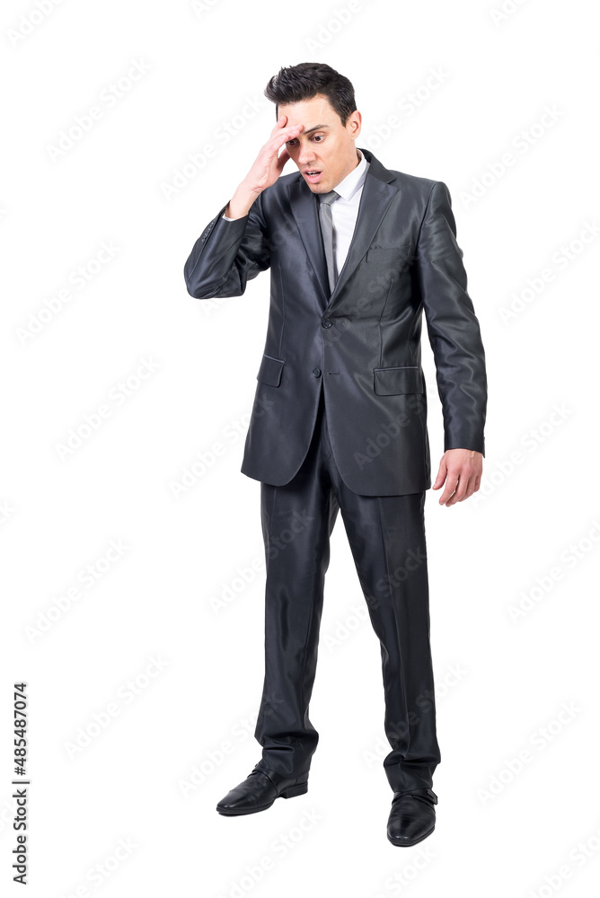 Concerned businessman making mistake and touching forehead Concerned businessman making mistake and touching forehead